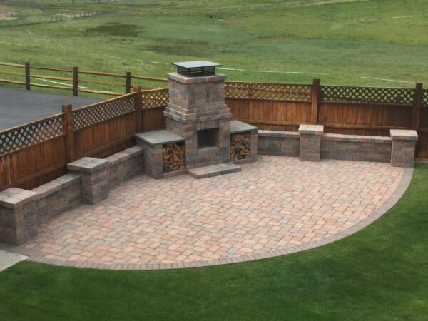 Outdoor design fireplace with synthetic turf