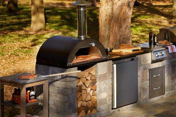 paver kitchen in backyard with wood burning stove