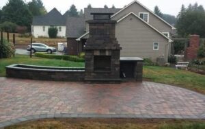 Gray Outdoor fireplace and paver patio in Olympia