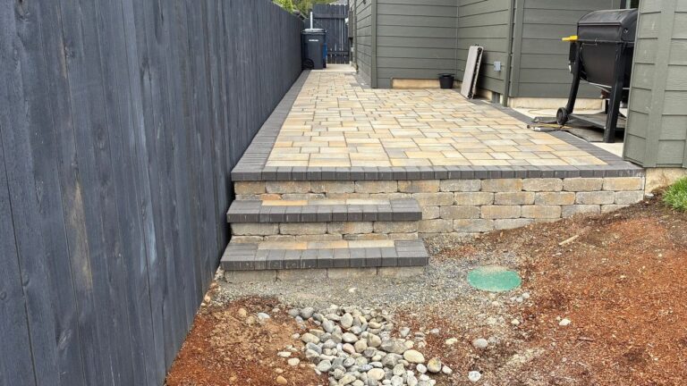 Paver Walkway Installation in Vancouver, WA: A 55-Foot Side Yard Run and a Raised Terrace on a 64-Foot Grade Wall