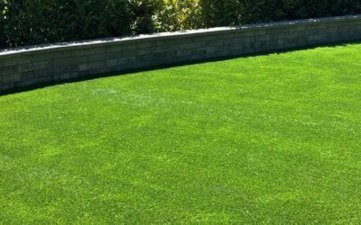 Outdoor Living 3 Retaining Wall and Artificial Turf Installation in Seattle, WA: A 78-Foot Curved Belgard Wall Leveling a Mossy Side Yard