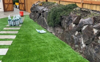 Outdoor Living 2 Artificial Turf and Paver Walkways in Renton, WA: 2,150 sq ft of Turf Along a Rock Wall, Stepping Stones and Scandina Grey Side Yards