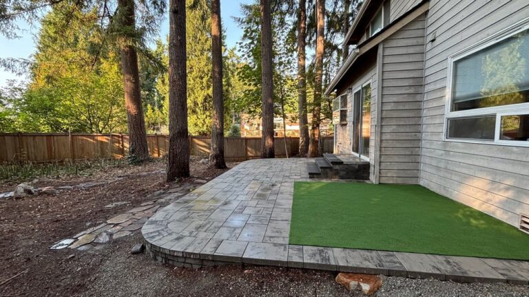 Two-Level Paver Patio and Putting Turf in Redmond, WA: An Overgrown Fir-Shaded Backyard Cleared and Built Around the Trees
