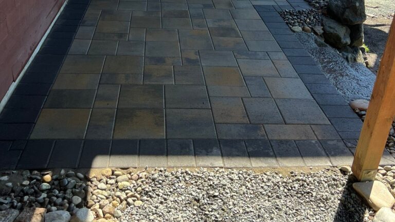 Paver Patio and Walkway in Everett, WA: 324 sq ft of Catalina Grana Under a Deck, With a Door Step and a Downspout Drain